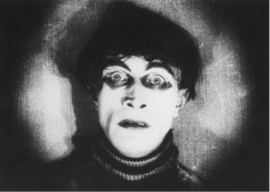 screen shot of somnambulist Cesare's face with an iris shot